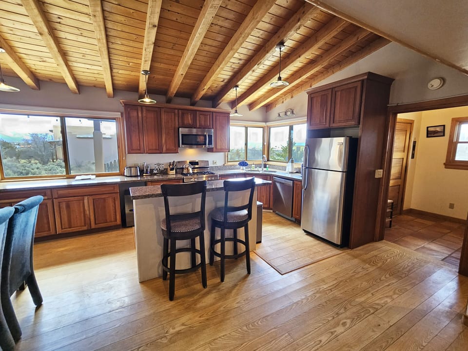 Well equipped kitchen with serving island and upscale appliances.