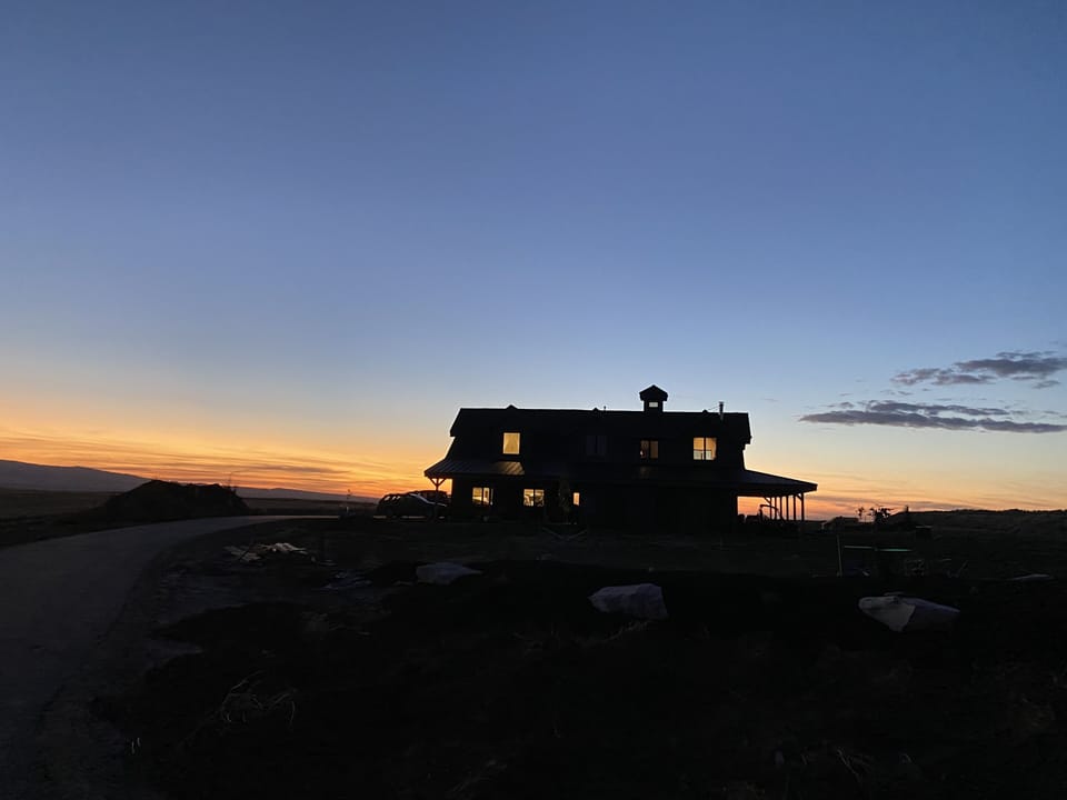 View of home at sunset from owners home to show space between properties