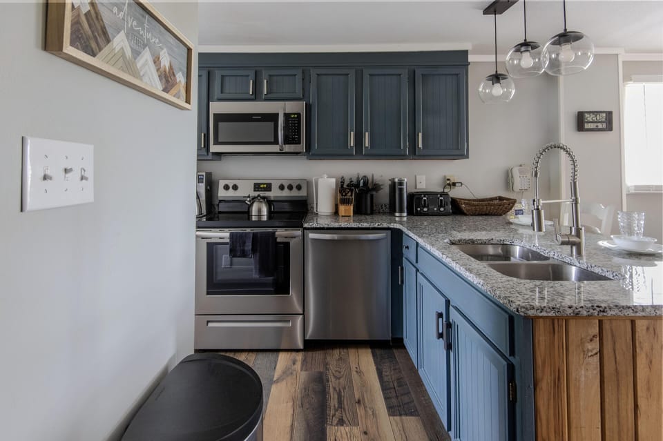 The kitchen has double kitchen sinks and a garbage disposal.