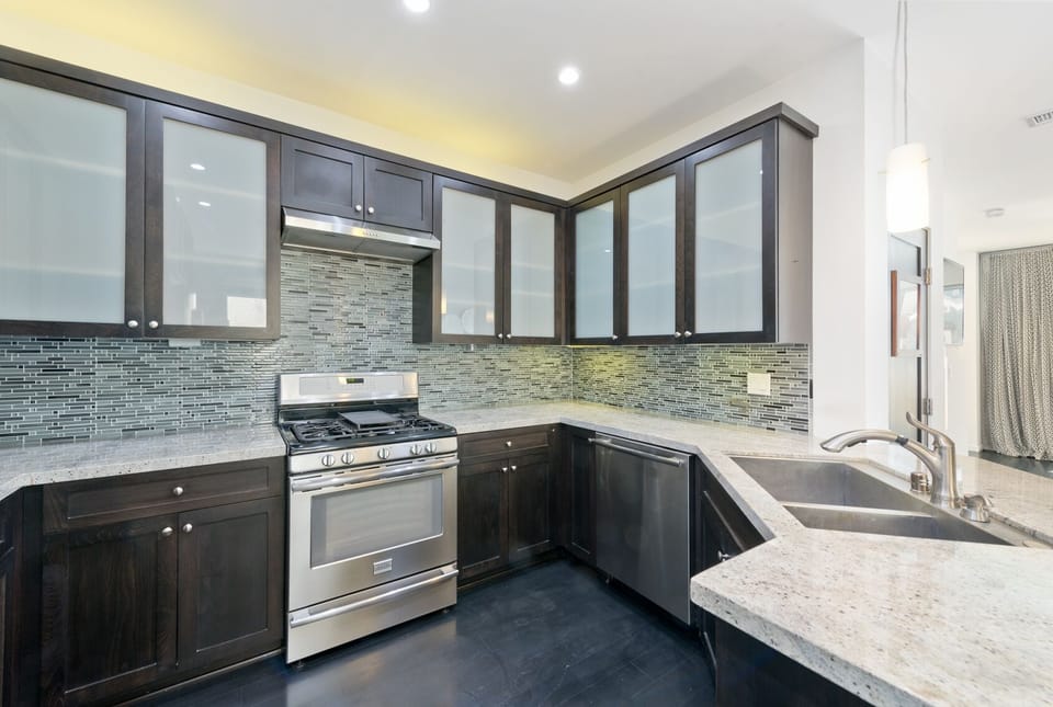 Kitchen includes glassware, dinnerware and bakeware