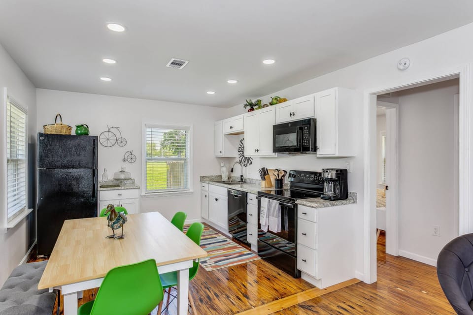 Open full size kitchen with updated black appliances