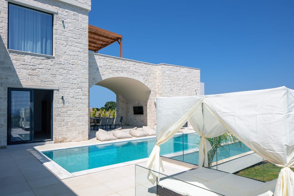 The stone archway welcomes guests to this luxury self-catering home in Crete.