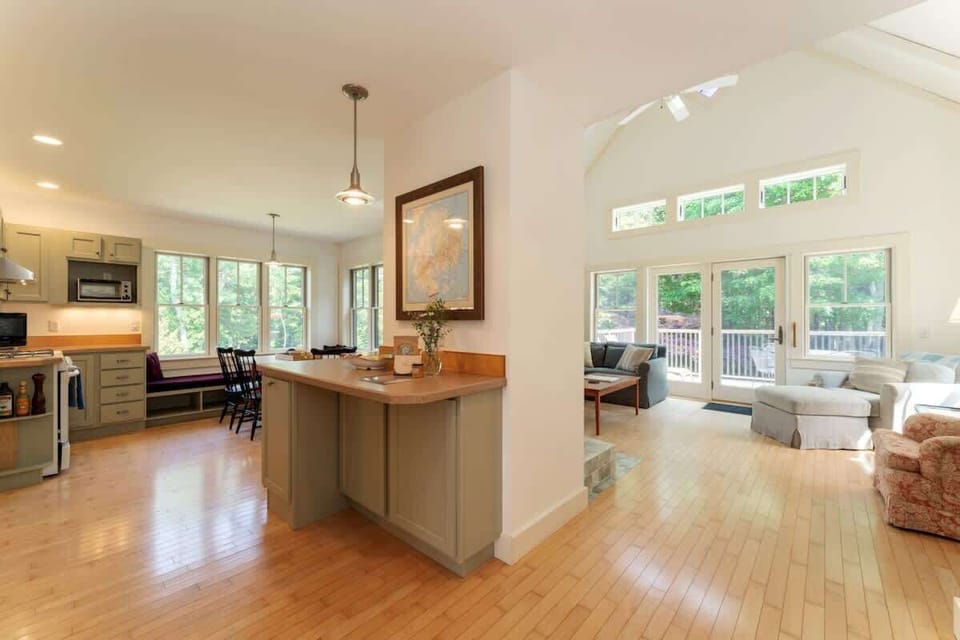 Central hallway leads to the living room, kitchen and dining areas.