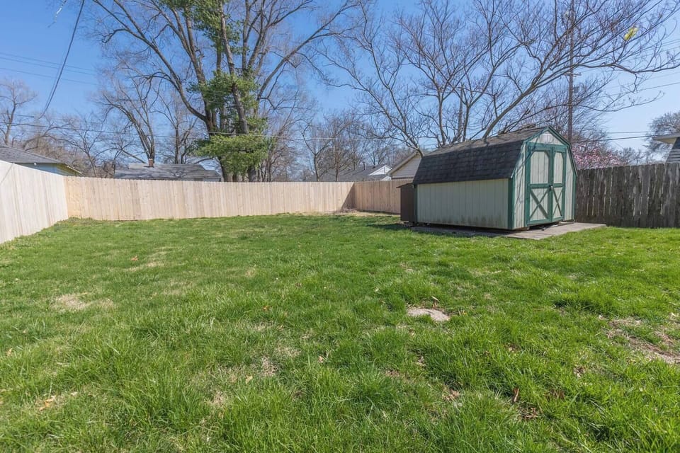 Large backyard with privacy fence