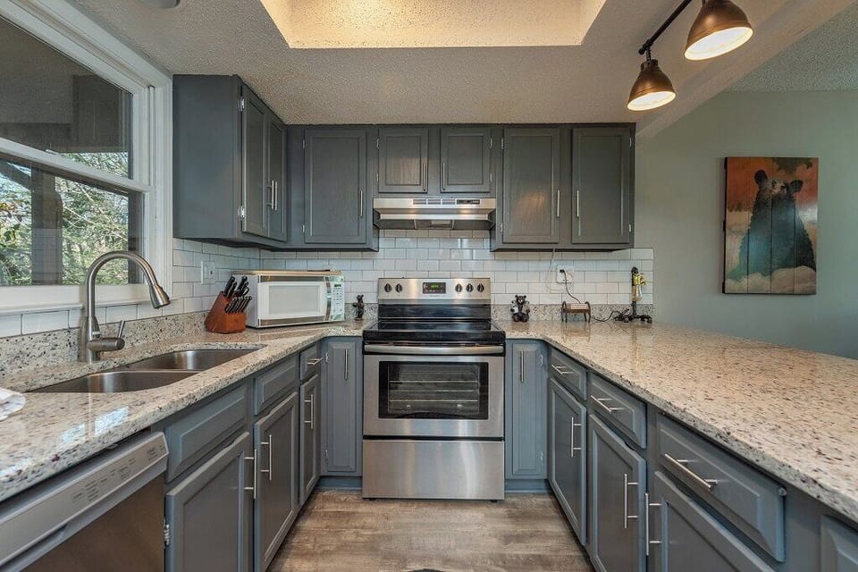 You'll have fun creating new family favorites in this upgraded stainless steel kitchen.