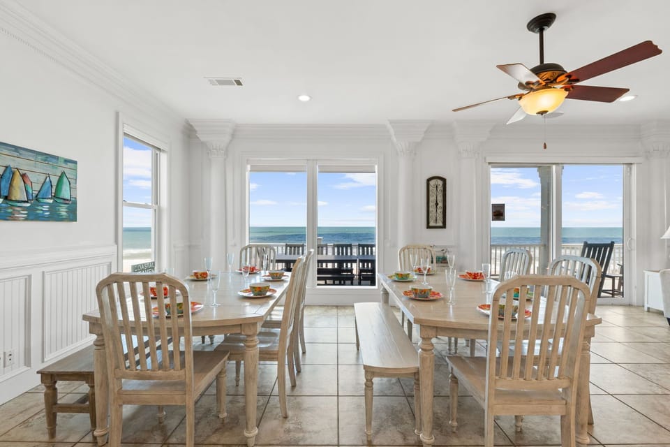 Gather around the dining table with ocean views stretching before you, where every meal becomes a seaside celebration framed by natural light and coastal breezes.