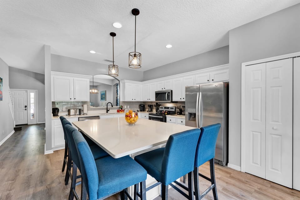 "Whip up delicious meals and unforgettable memories in our open kitchen, designed for both gourmet chefs and midnight snackers. With an island that beckons for gatherings, it's the place where stories are shared and laughter fills the air.