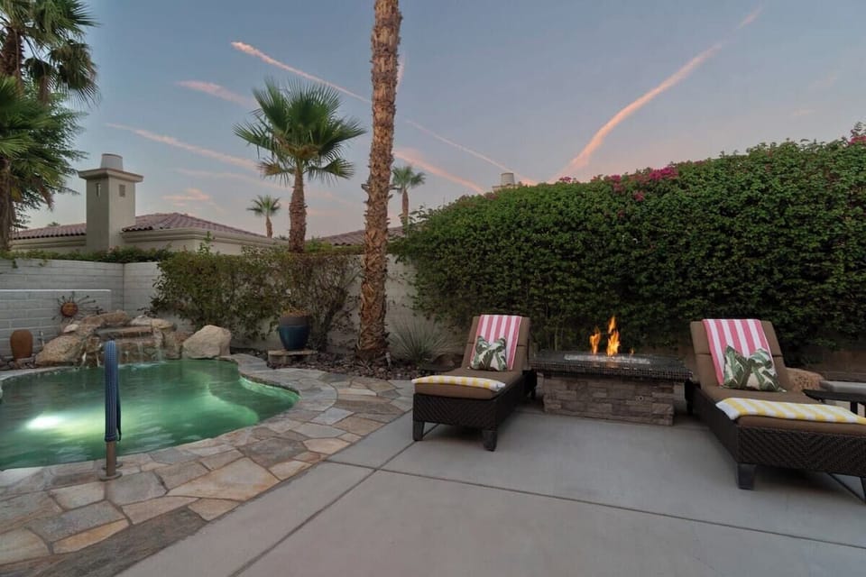 Enjoy the lovely sunset views while resting on the backyard loungers.