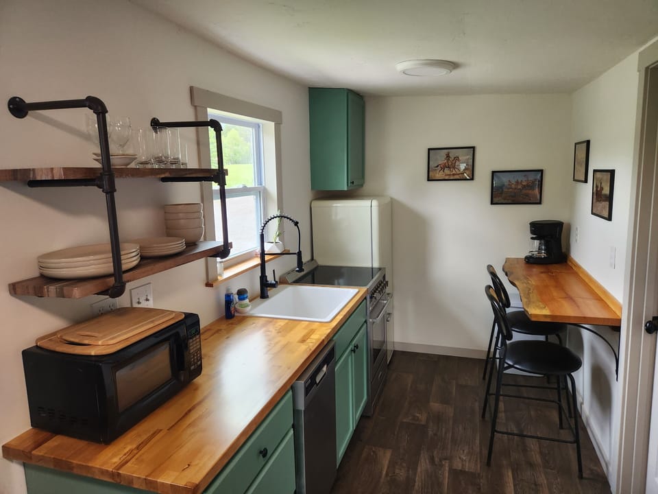 Kitchen: range, refrigerator, freezer, microwave, dishwasher, coffee maker.