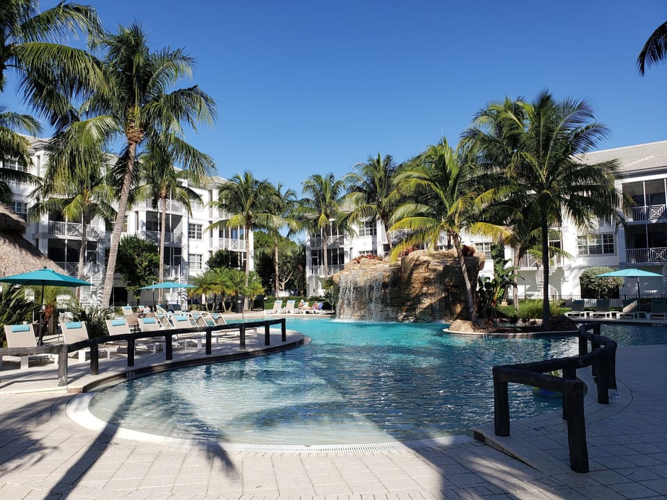 Beach Entry Resort Pool with Waterfall and Swim-around Island!