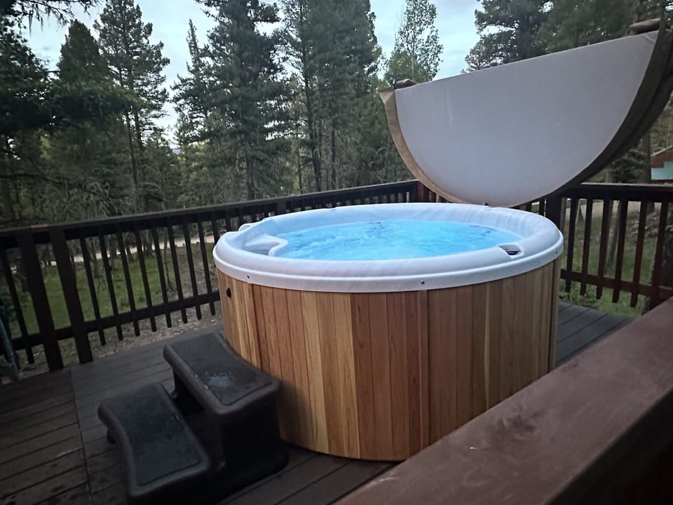 Newly added cedar, Nordic six person hot tub in June 2023