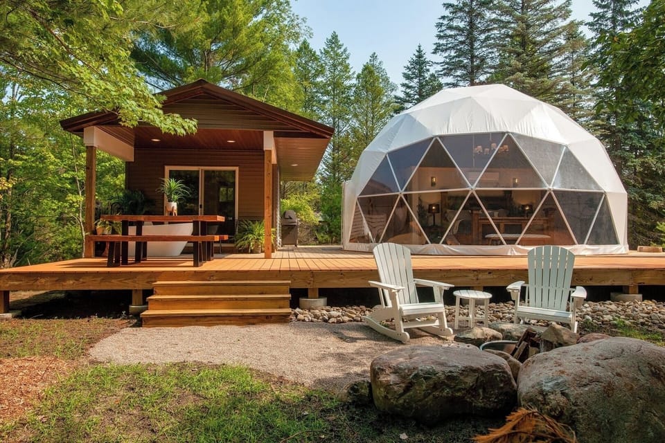 Relax and enjoy 928 square feet of living space on a 1,700 square foot deck surrounded by pristine northwoods forest.  A hammock will be added in spring of 2023.  