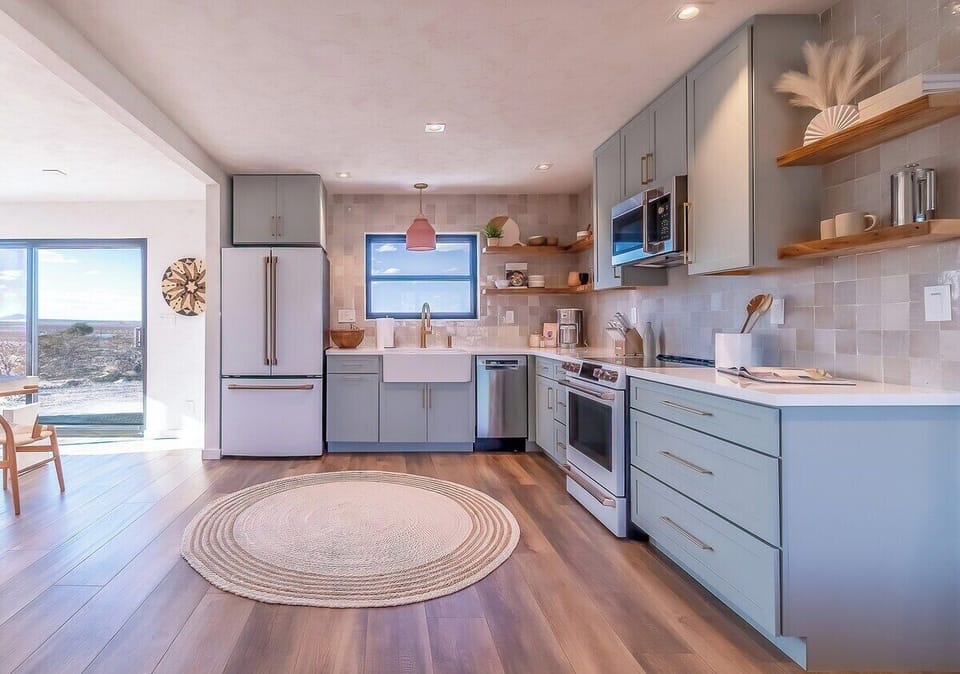 Stylish farmhouse fire clay kitchen sink, with a non-obstructive desert view through the window.