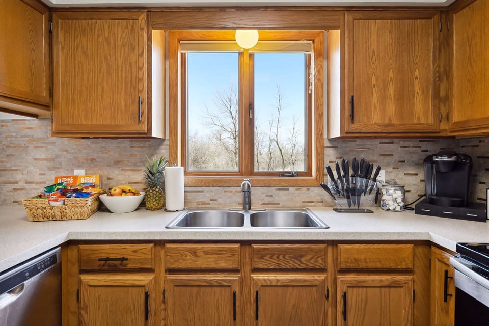 Kitchen: Complimentary snack basket, coffee bar, and beverage refrigerator. 