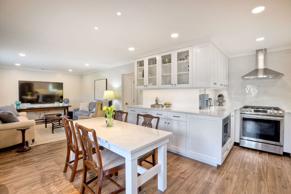 Open concept floor plan connects kitchen with dining area and living room