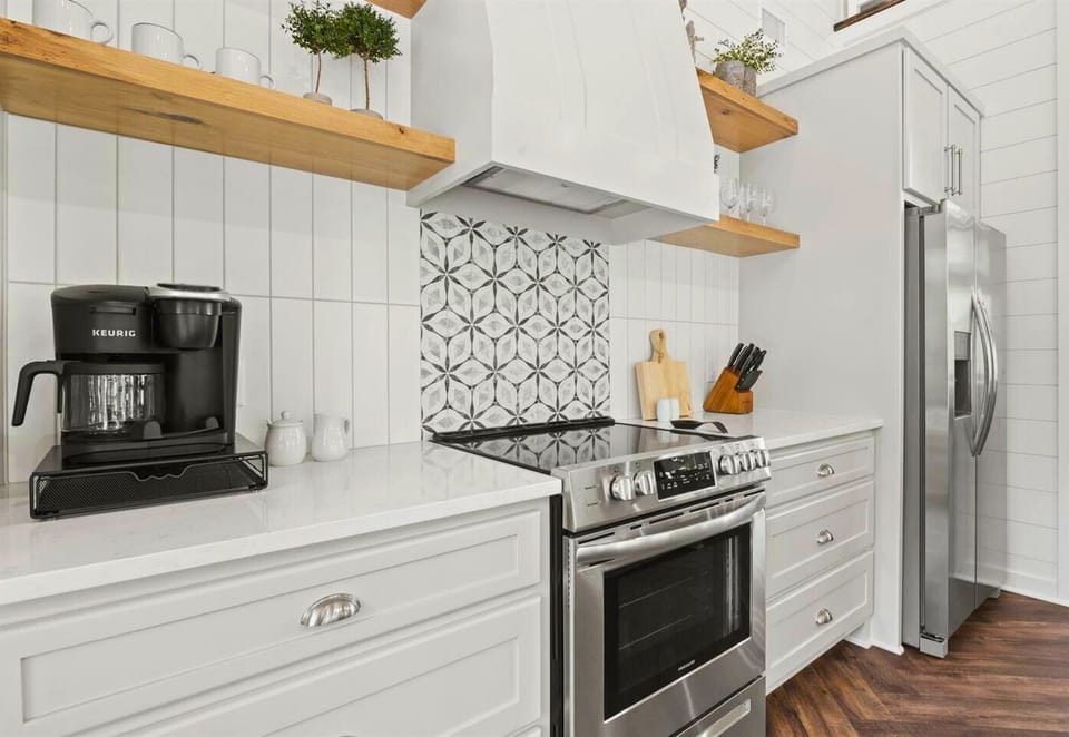 Brewing up a good morning in this sleek kitchen corner. The perfect blend of style and function for your coffee fix