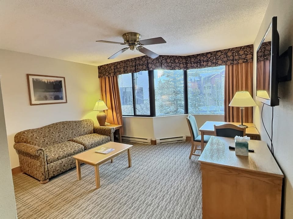 【Living + Kitchenette】Open living with a real kitchenette — couch for lounging (king sleeps 2)
Listed with @BookTraverse