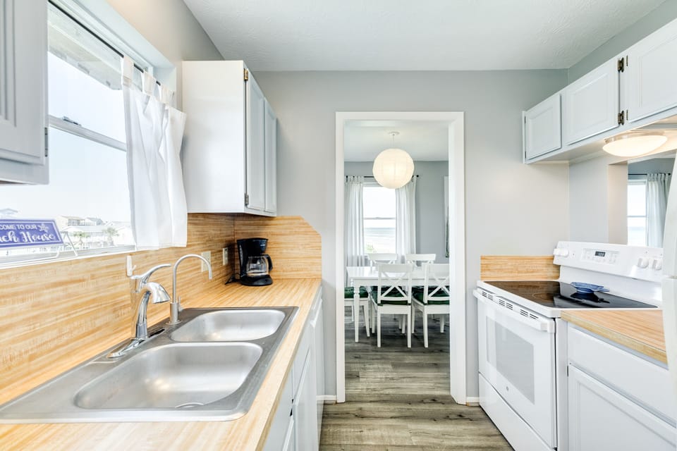 Galley style kitchen opens to the dining area