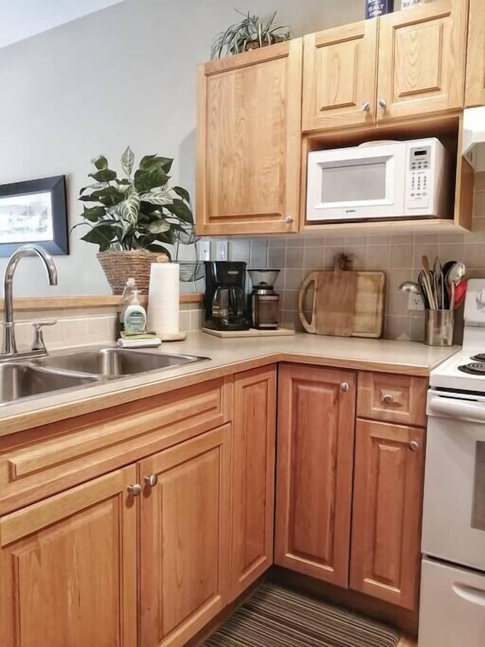 Fully equipped kitchen overlooking the dining area.