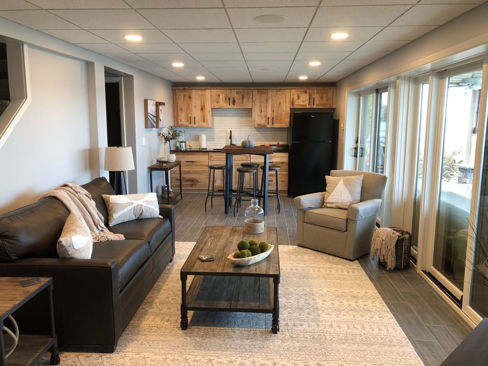 Lower level of the house-family room and wet bar. Couch pulls out into queen bed