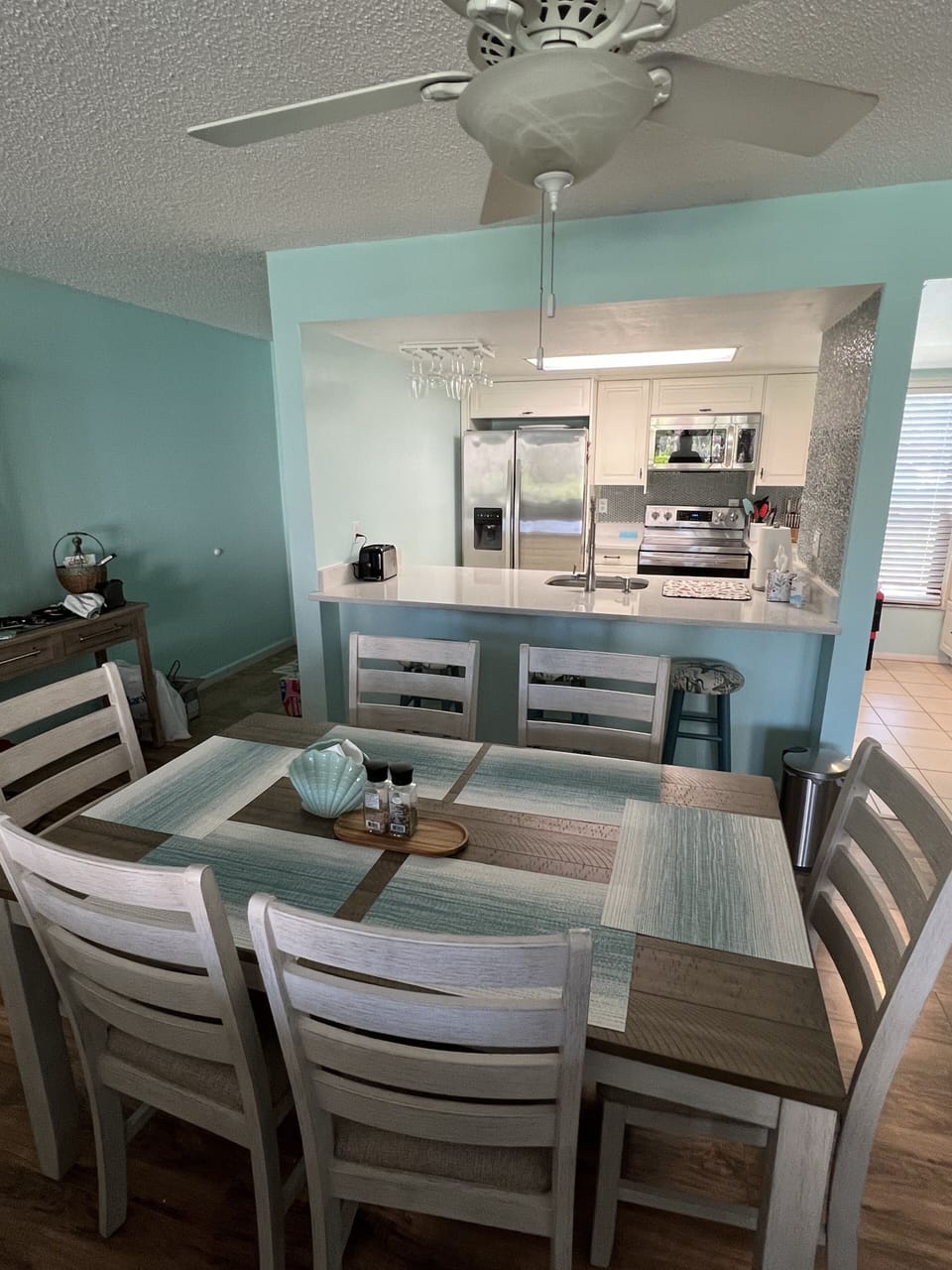 Dining area centrally located in this open concept home.  More seating at bar.
