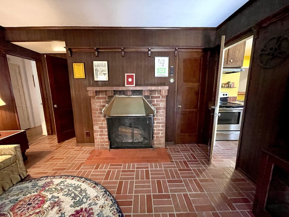 Den with decorative fireplace