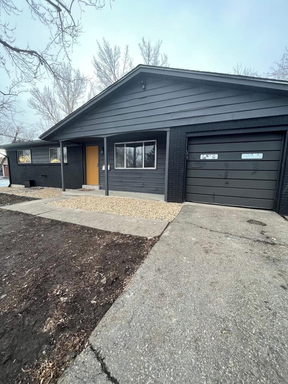 Front View of the House – A welcoming exterior showcasing the home’s charming features, including a well-maintained lawn and inviting entrance.