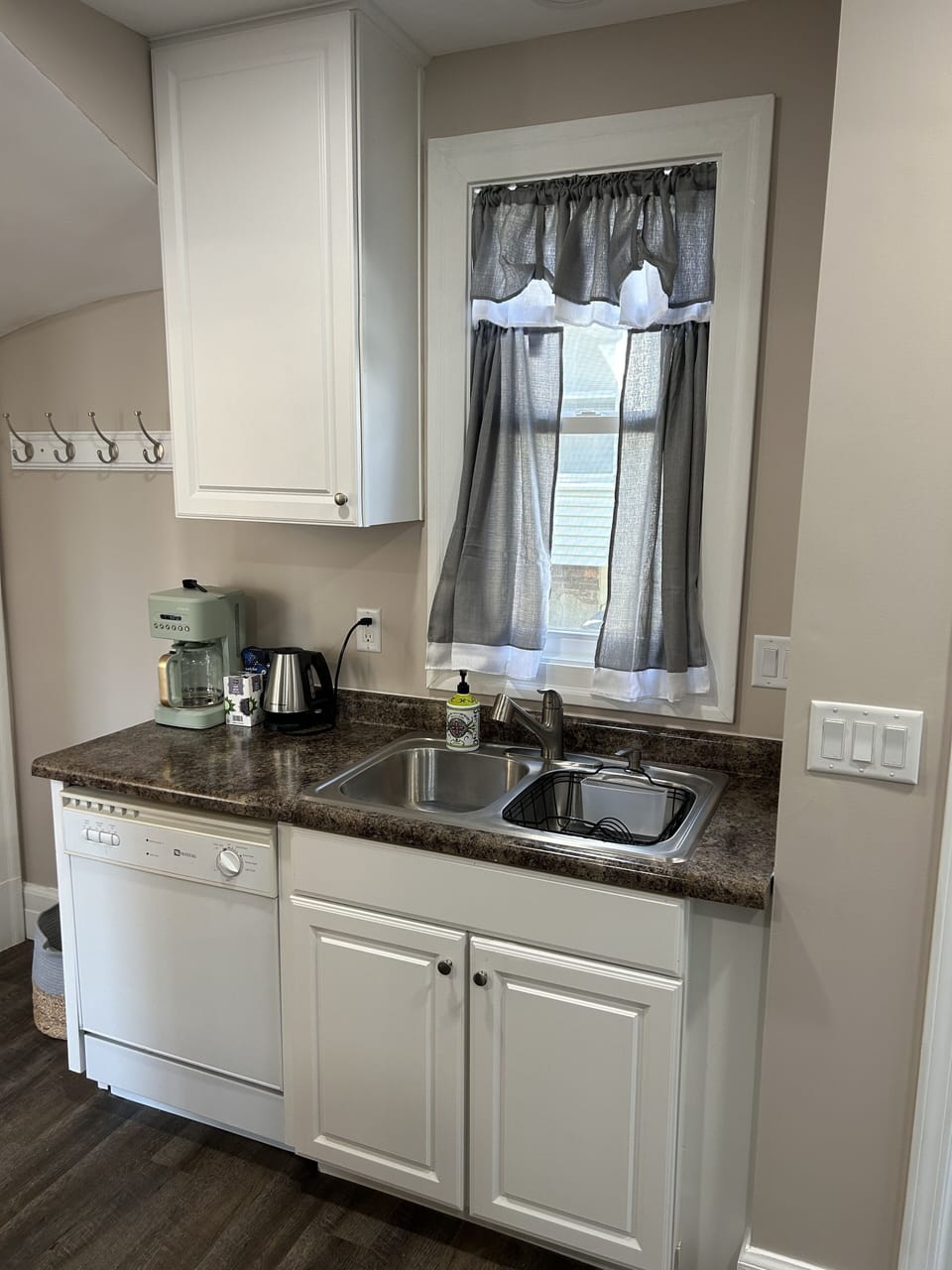 Kitchen includes coffee maker, tea kettle, toaster...