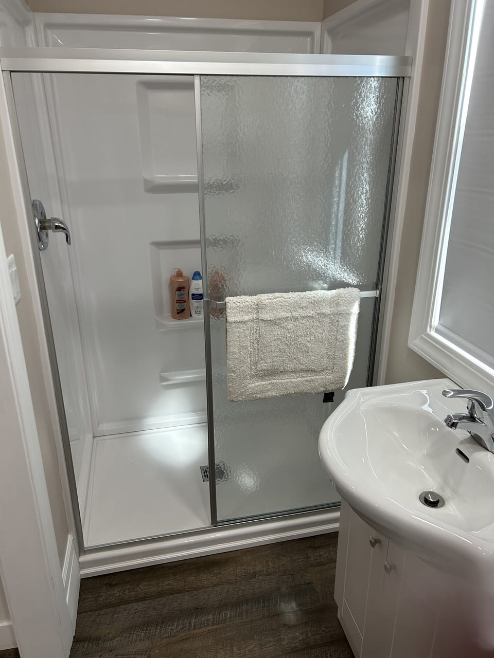 Downstairs bathroom - shower, sink & toilet