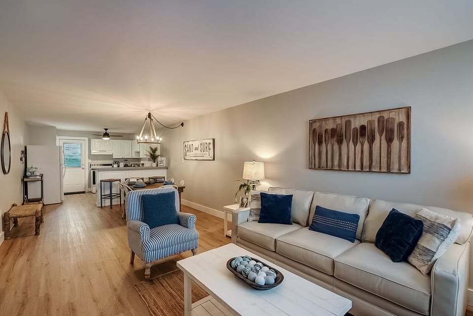Sink into coastal comfort in this beautifully appointed living space, where nautical touches and plush seating create your perfect seaside retreat.