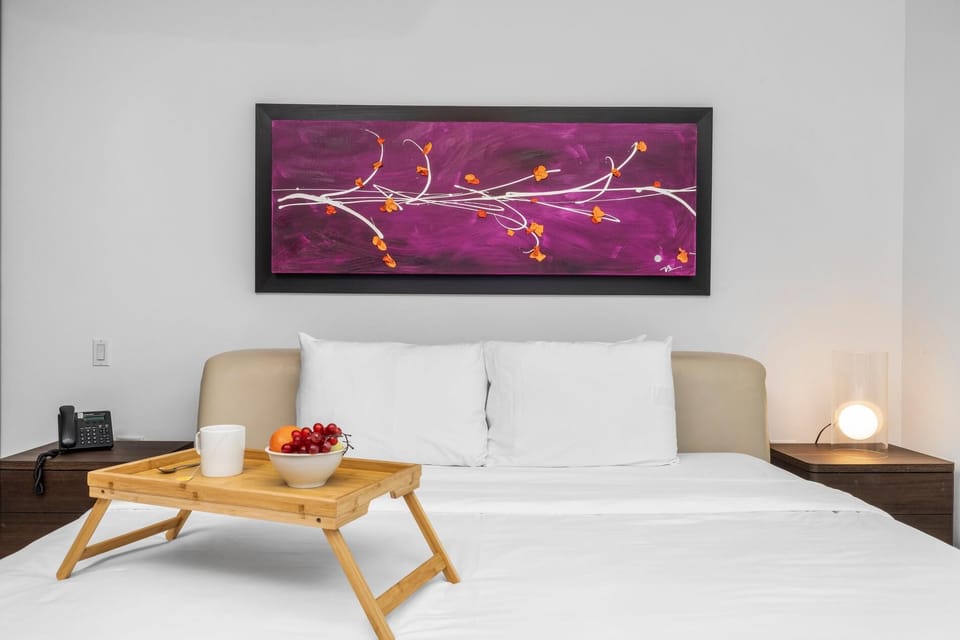 A cozy and comfy bed after a long day. With a TV to watch your favorite show.