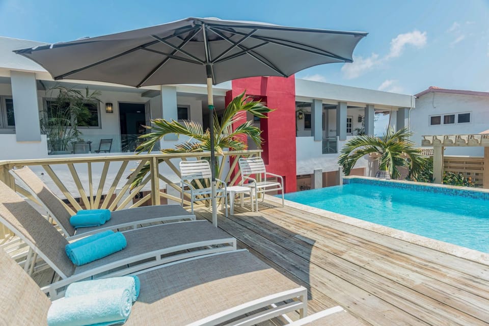 Enjoy the beautiful Aruban weather outside   lounging by the pool 