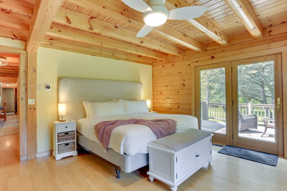 Master bedroom with view of river and jacuzzi access