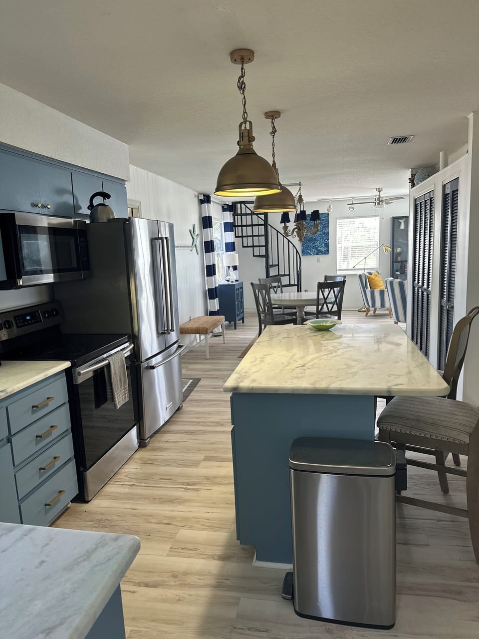 Fully stocked kitchen with high end appliances and a dishwasher.