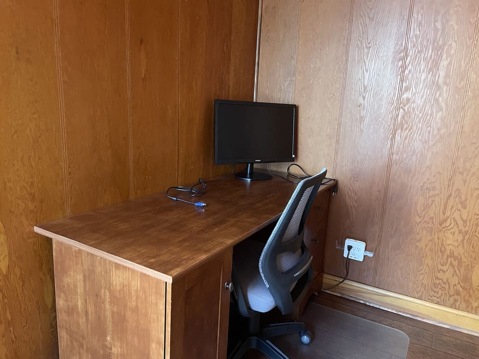 Work desk with monitor in the second bedroom