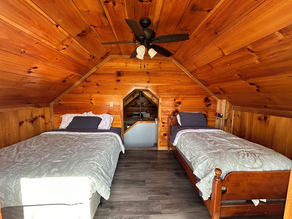 Queen and twin bed upstairs, connected to the balcony.