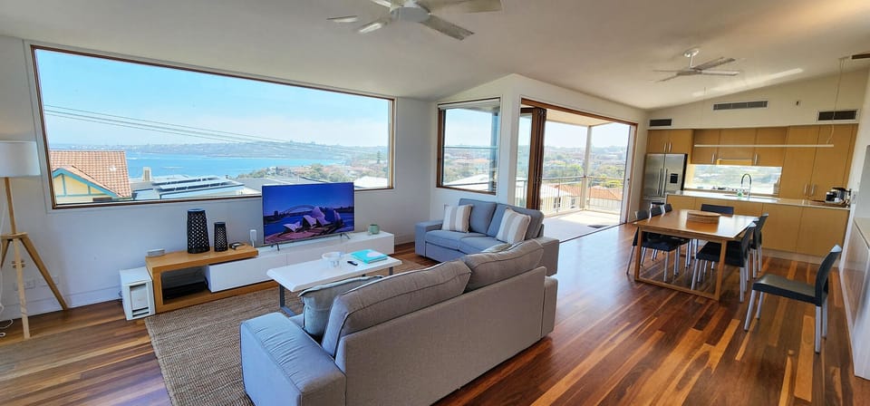 Living room and kitchen upstairs - beautiful ocean views