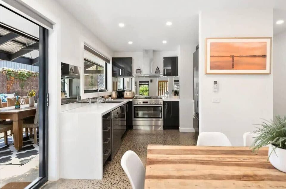 The kitchen and dining area overlooks the pool