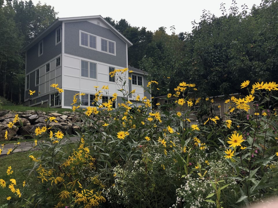 The outside of the house. All bedroom windows have mountain views. 