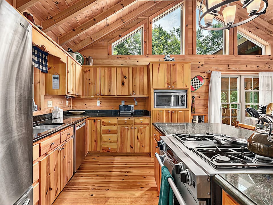 Open concept gourmet kitchen with mountain views