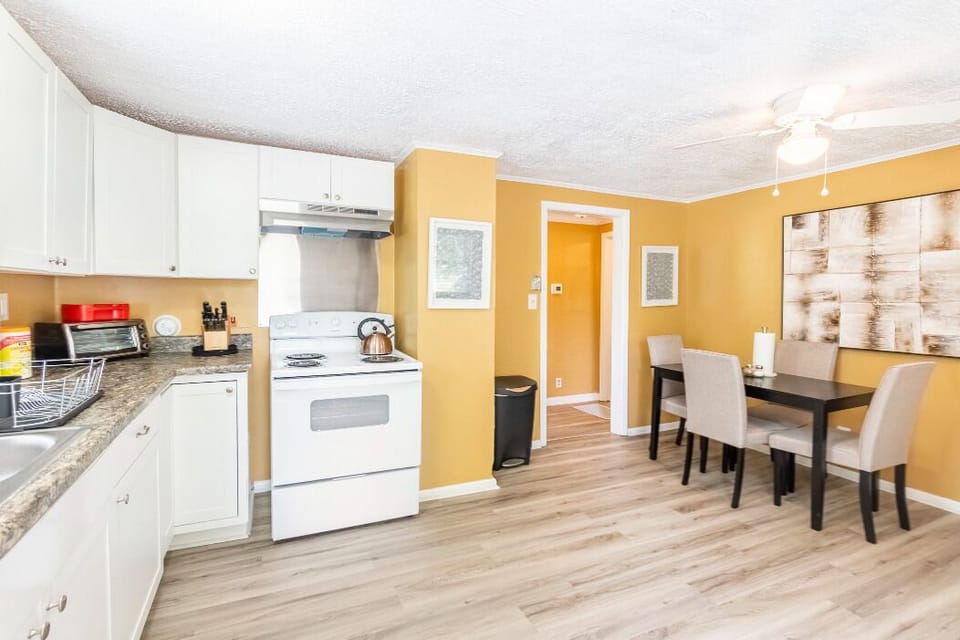 Exquisite newly remolded kitchen with dining area.