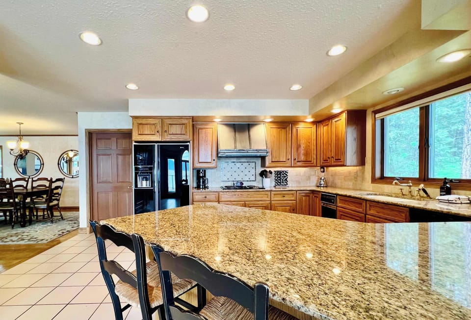 Large gathering Kitchen with bar and dining area