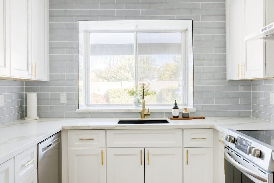 Modern New Kitchen with Views to Backyard Pool! Stove. Fridge. Freezer. Blender. Oven. Toaster. Coffee Maker & Pods. Dishes. Wine Glasses. Cups. Mugs. Cutting Boards. Mixing Bowls. Salt & Pepper. Oil. Sugars for your tea of coffee. Pots and pans.