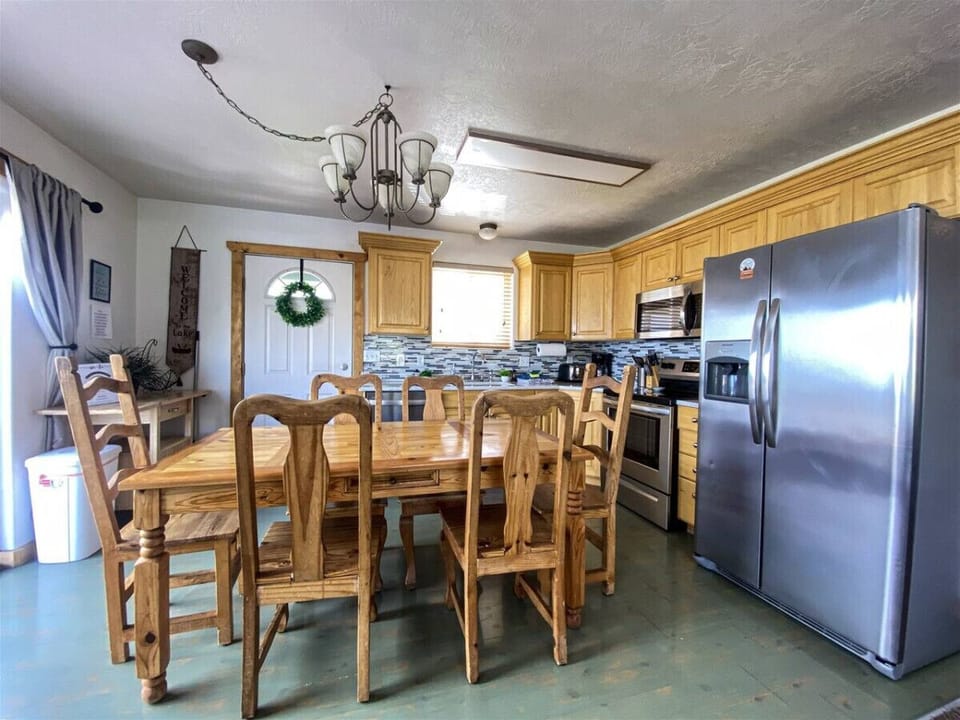 Warm, rustic kitchen with modern appliances—perfect for cooking meals and gathering with loved ones.
