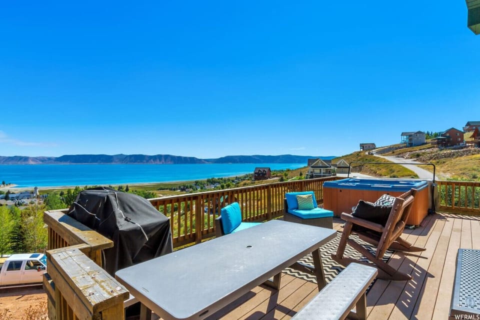 Spacious deck with hot tub, grill, and unbeatable views of Bear Lake’s turquoise waters.