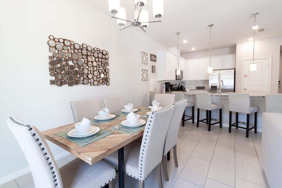 Dining room table comfortable seats 6 plus the kitchen bar seating.
