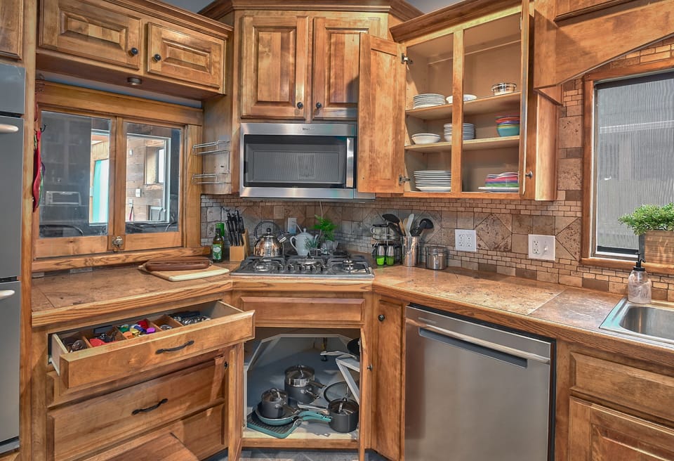 Stocked kitchen is ready with all cooking and serving items for a family dinner.