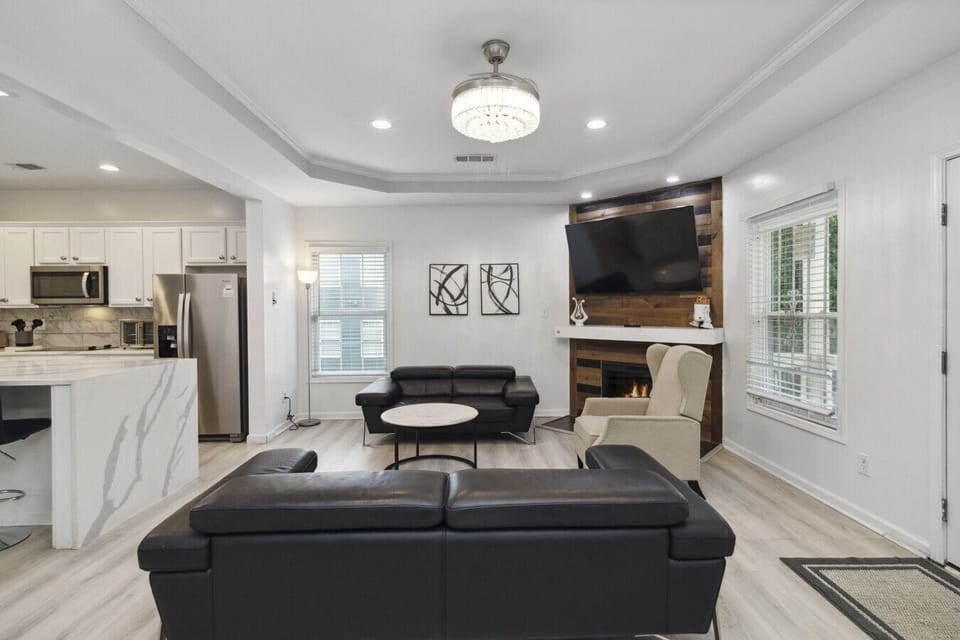 Welcome to your ultimate modern sanctuary — the living room where style meets comfort! Sink into sleek leather couches that scream luxury, surrounded by clean lines, bold accents, and a vibe so fresh it redefines contemporary living. This isn`t just a liv