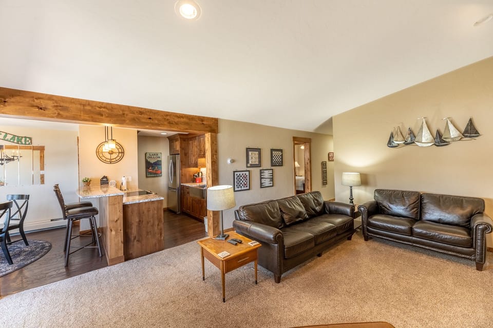 Relax in your spacious living room with plush leather seating, then whip up meals in the fully equipped kitchen with rustic wood finishes.