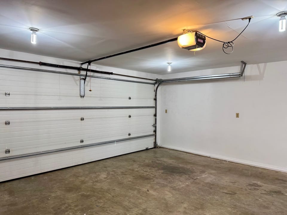 Double garage is spacious for enough for two cars or four bikes.